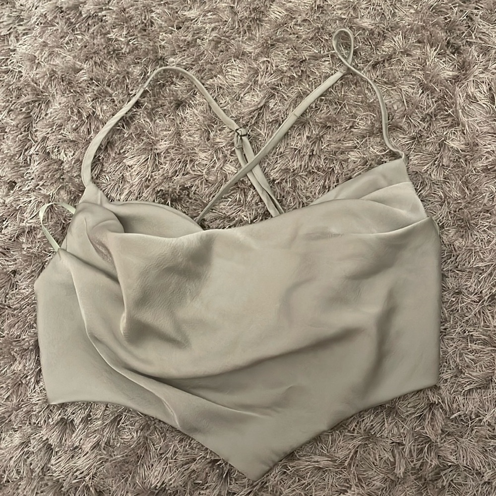 Grey going out top. Adjustable straps. New with tags.